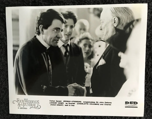 PUBLICITY PHOTOGRAPH - from FOUR WEDDINGS AND A FUNERAL(e) (1994) -  Hugh Grant, Rowan Atkinson, Jeremy Kemp, Charlotte Coleman