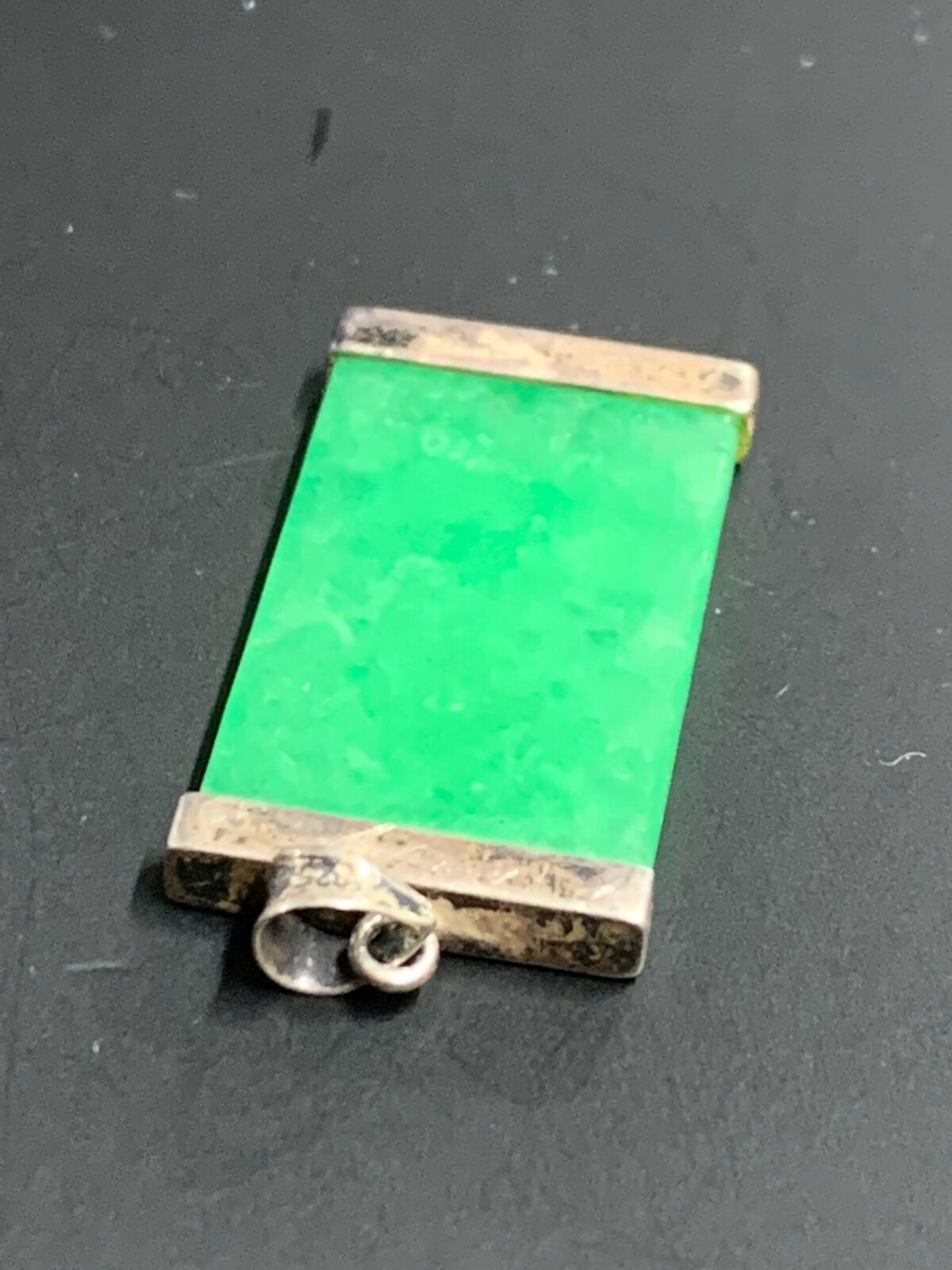 STERLING SILVER AND JADE PENDANT - UNKNOWN TEXT