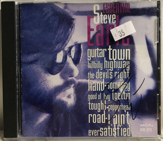 MUSIC CD IN CASE (COVER SIGNED) - STEVE EARLE - ESSENTIAL STEVE EARLE