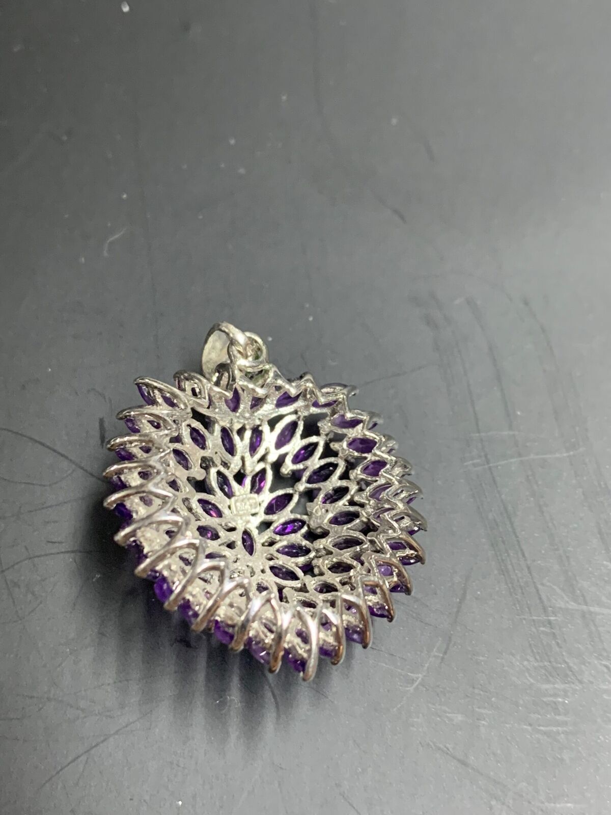 STERLING SILVER PENDANT - MANY UNKNOWN PURPLE STONES