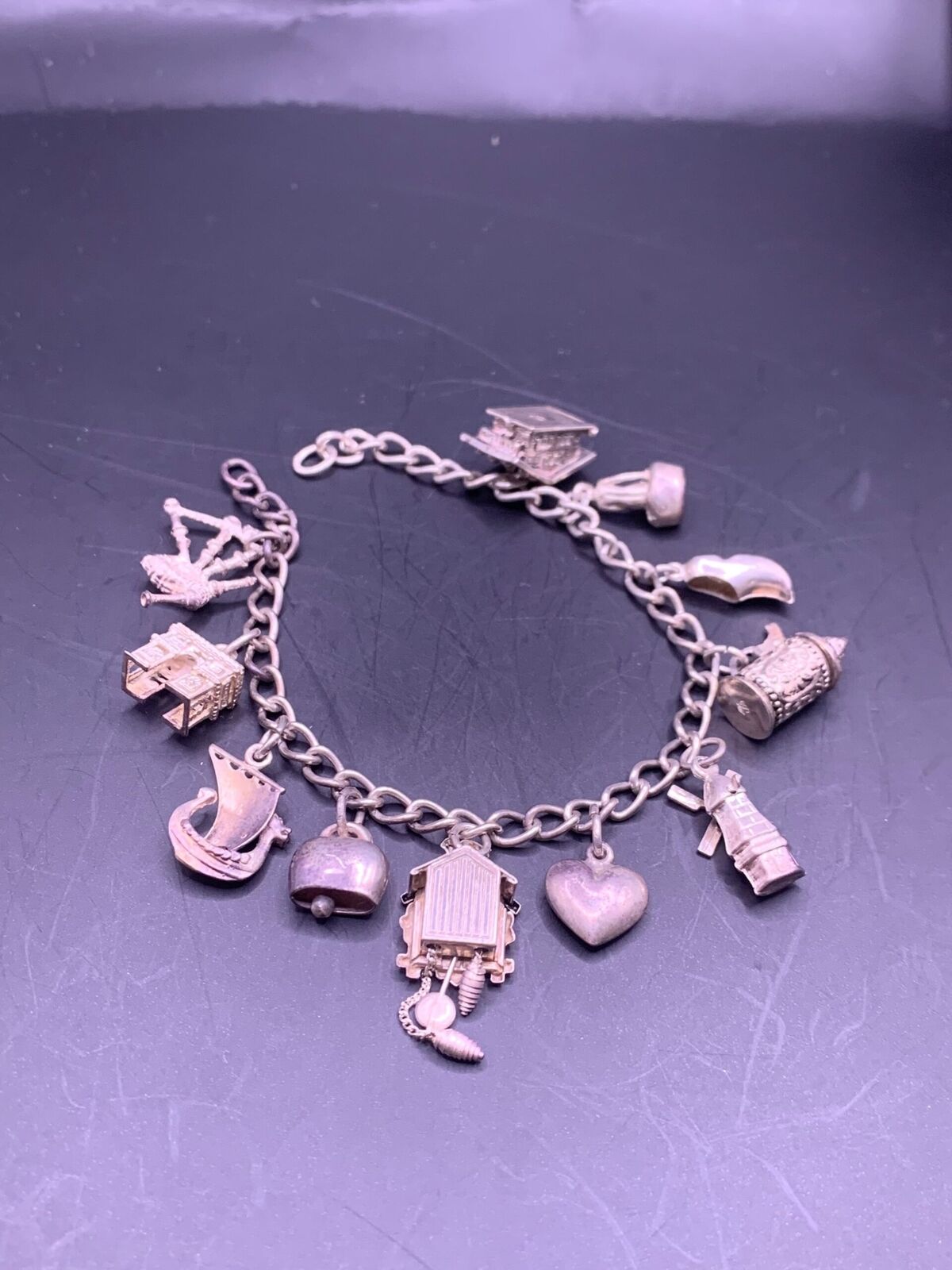 STERLING SILVER CHARM BRACELET - 11 CHARMS 925