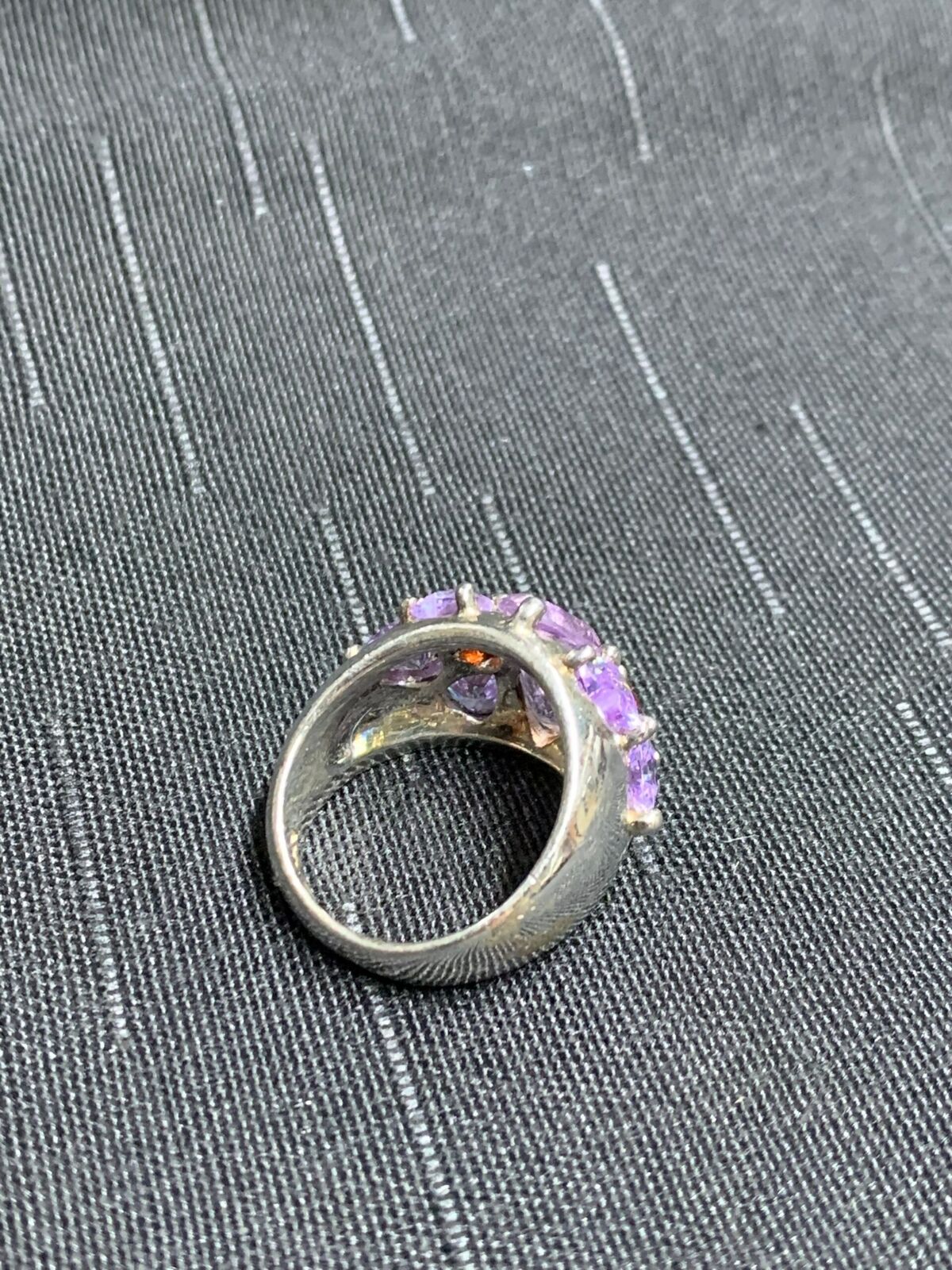 SILVER RING - WITH UNIDENTIFIED STONES - WITH PINK, VIOLET, & RED STONE SETTING