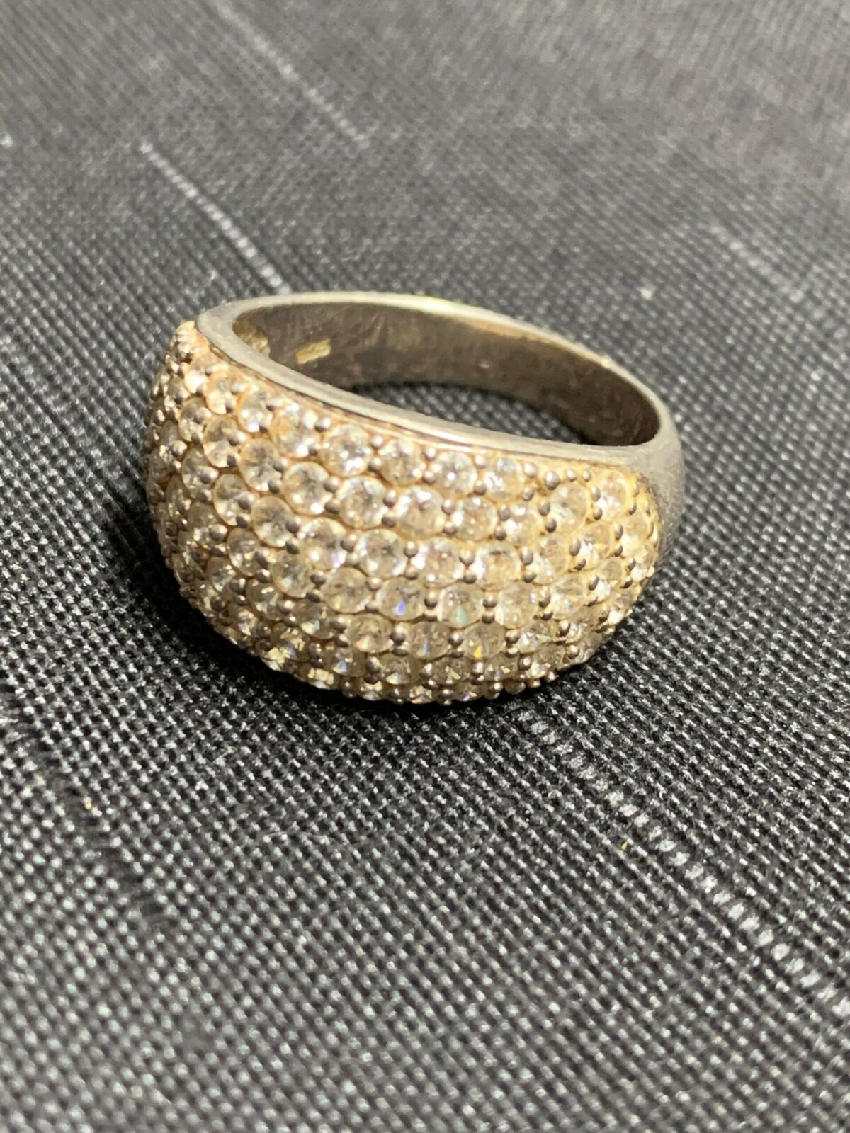 SILVER RING - WITH MANY UNIDENTIFIED WHITE STONE SETTINGS