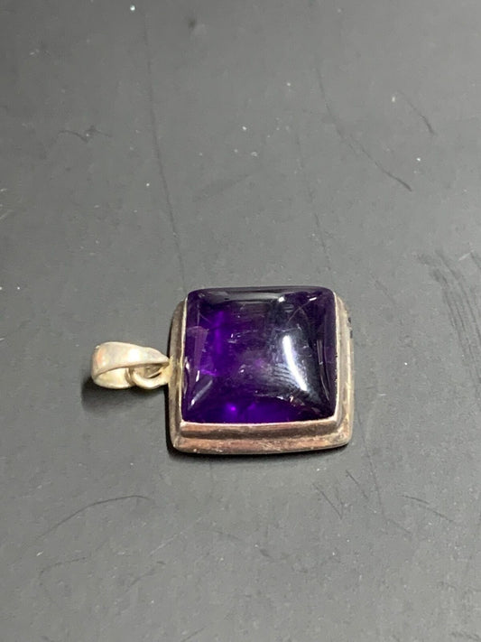 SILVER PENDANT WITH LARGE PURPLE STONE